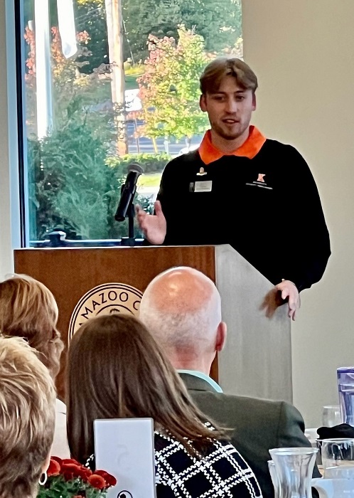 Student speaking at the Kalamazoo Community Breakfast