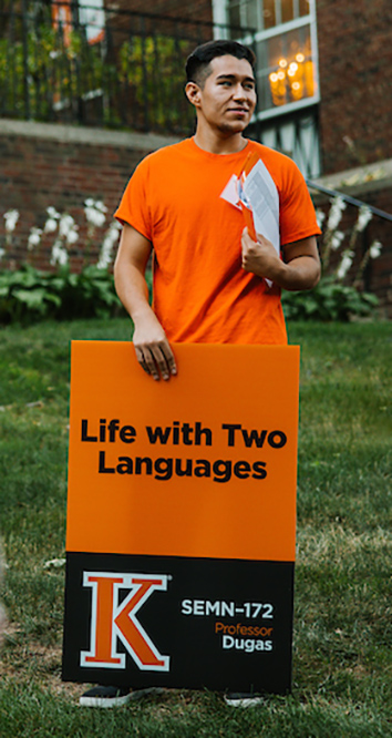 First-year experience mentor holding a sign