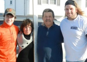 K cross country runner Brock Crystal ’15 (l) and WMU football player Nick Norton (r) helped New Jersey homeowners Vicki Laudien and Joe Danski clean up after Hurricane Sandy
