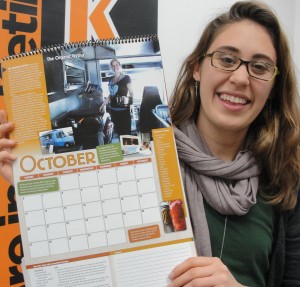 Shoshana Schultz holds the calendar for "A Year of Food in Kalamazoo"