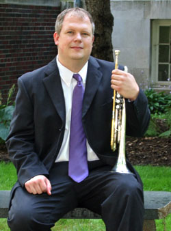 Keith Geiman sitting with a trumpet