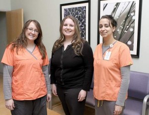 Molly (Shelter) Parker (center) with her new medical assistants at the Three Meadows Medical Plaza