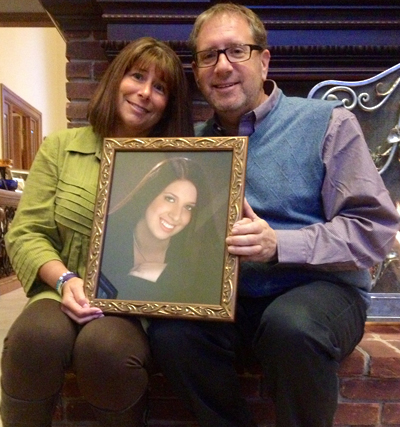 Alicia and Michael Stillman hold a picture of their deceased daughter, Emily