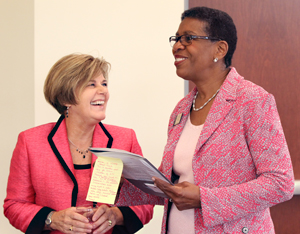 Janice Brown of Kalamazoo Promise smiles at K President Eileen B. Wilson-Oyelaran