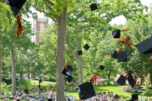 Graduation caps are thrown in the air