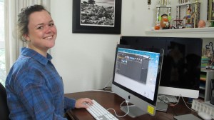 Jessie Fales smiling at a desktop computer