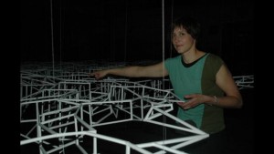 Sarah Lindley stands next to her 3D art