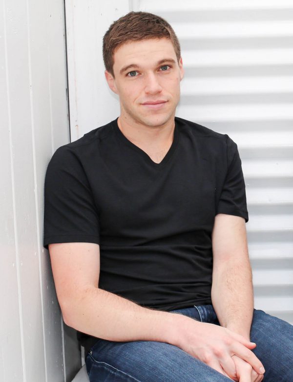 Peter Rothstein, a 30 Under 30 honoree, in a black t-shirt and blue jeans