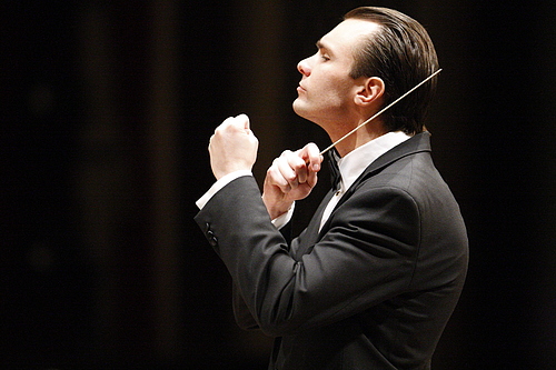 Community Medal of Arts Recipient Andrew Koehler conducting