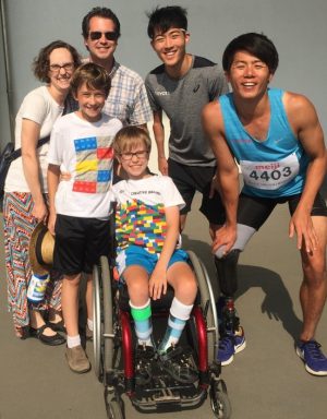 Disability Sports Book Author Dennis Frost with family and two Japanese Paralympians