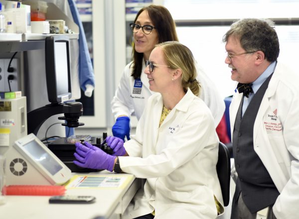 Jill Weatherhead and her science mentors in a lab