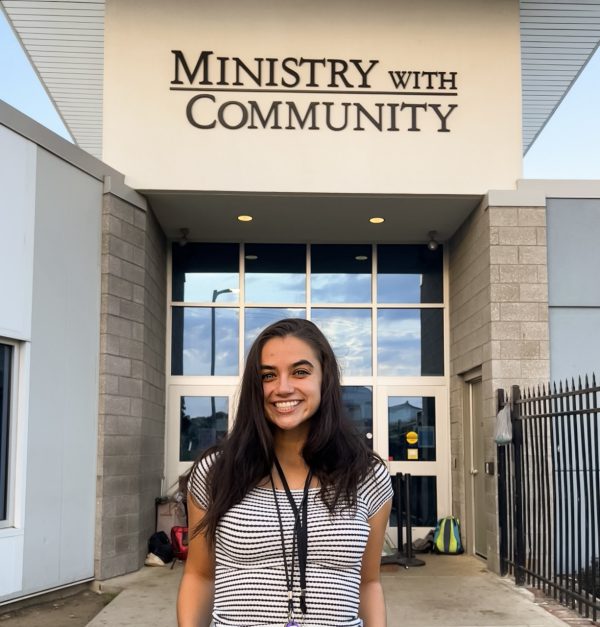 Restorative justice professional Steph Guyor '22 outside Ministry with Community in Kalamazoo