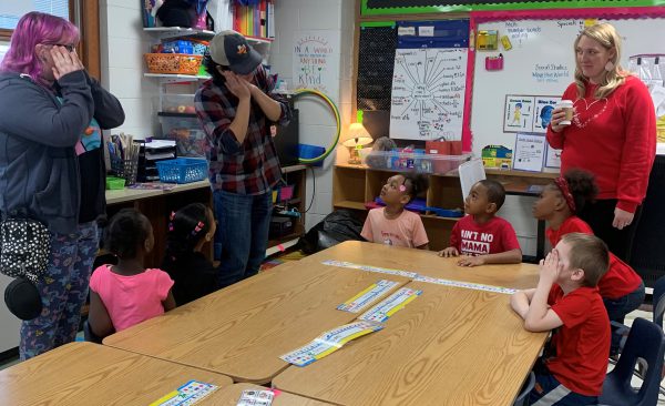 Kalamazoo College students help children learn words and phrases in the language