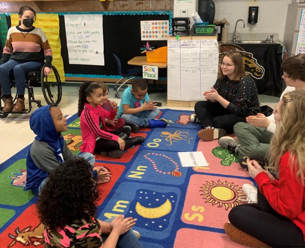 Kalamazoo College introductory German students help children learn words and phrases in the language