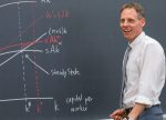 Patrik Hultberg working at a blackboard as quantitative economics major comes to Kalamazoo College