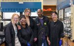 Dwight Williams stands in his lab with four of the students who worked under his guidance this summer