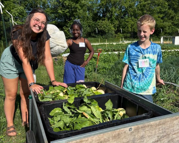 Hannah Parsons and students harvest radishes at DeLano Farms