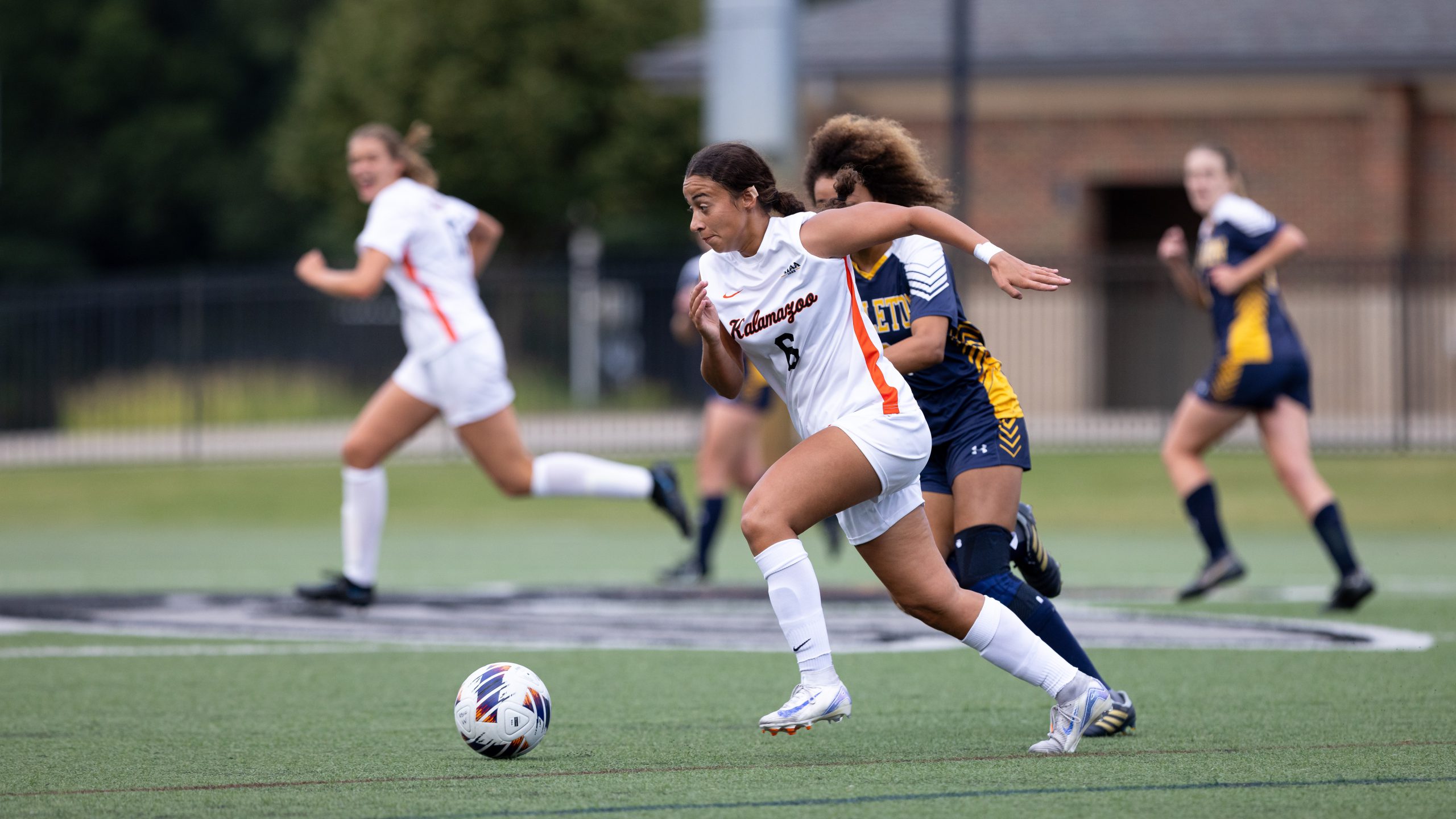 Miyani Sonera driving downfield during a Kalamazoo College women's soccer game