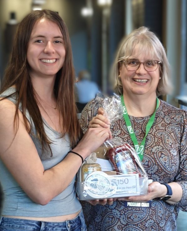Student Annaliese Bol receives an award for her ecology research