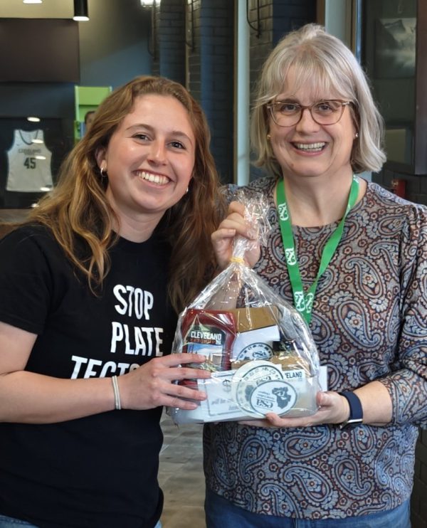 Student Mia Crites receives an award for her ecology research