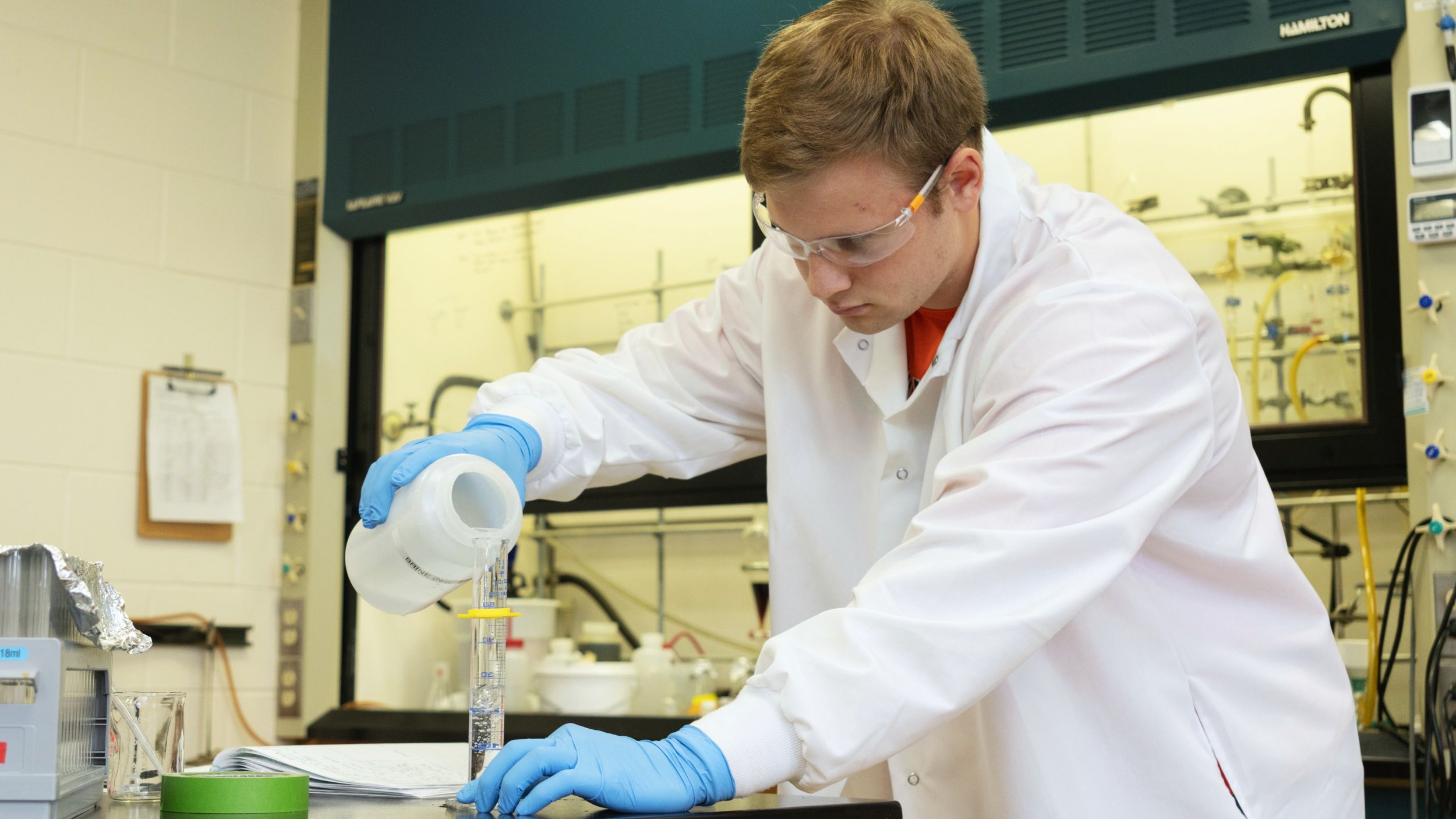 Student-athlete Logan Coller performing summer research in the lab of Blake Tresca