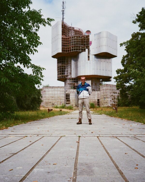 Peters stands outside the Monument to the Revolution at Mrakovica.
