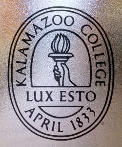 Seal of Kalamazoo College with motto "Lux Esto" and founding date, April 1833