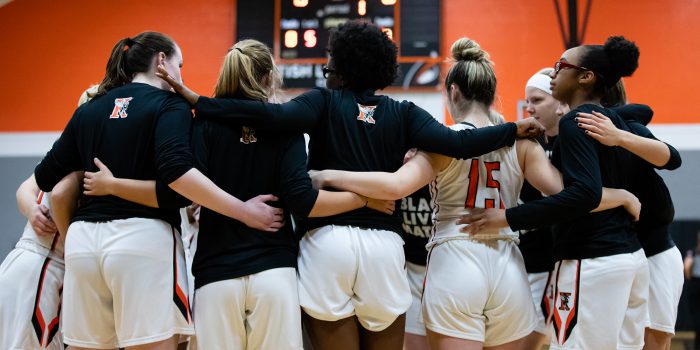 women's basketball team huddle