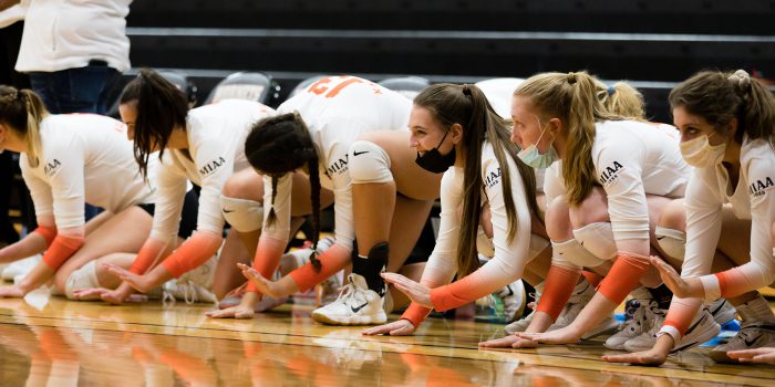 volleyball team doing a pregame ritual