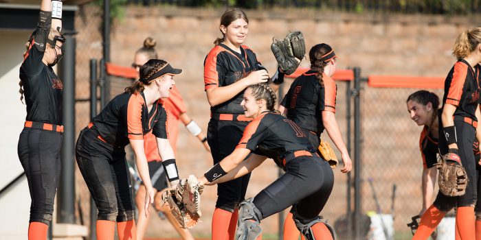 softball team celebrating