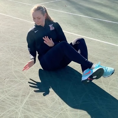 Ella Knight exercises at a tennis court