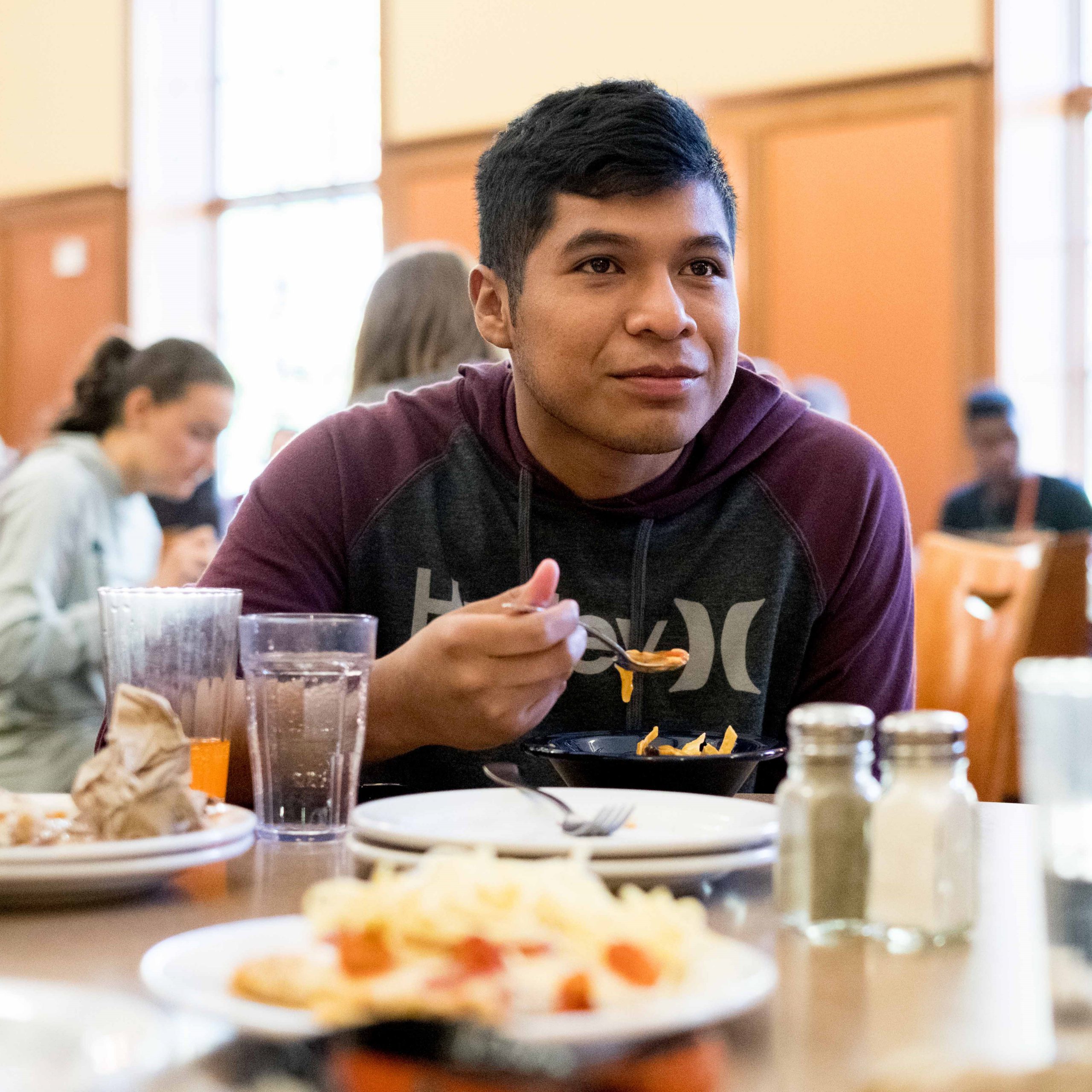 Student eats at Hicks Center cafeteria