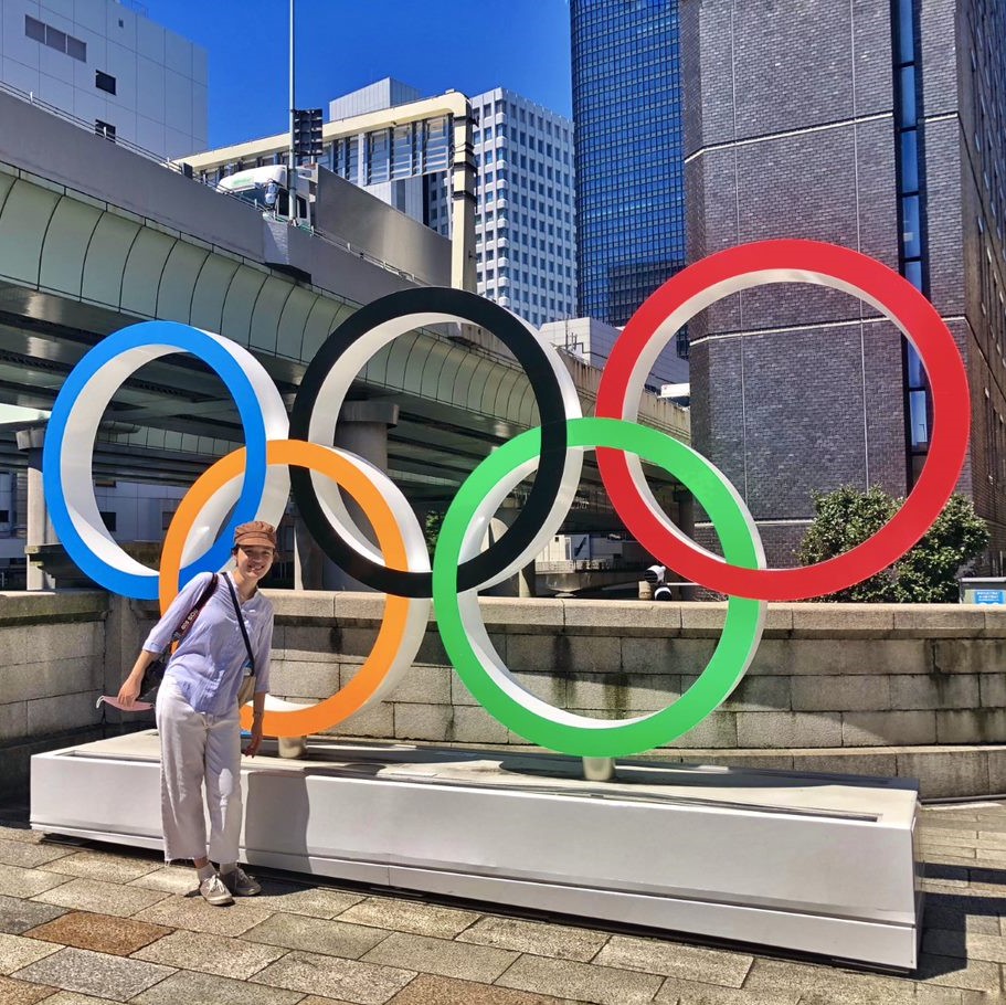 Uyen Trinh standing next to the Olympic rings_showcase