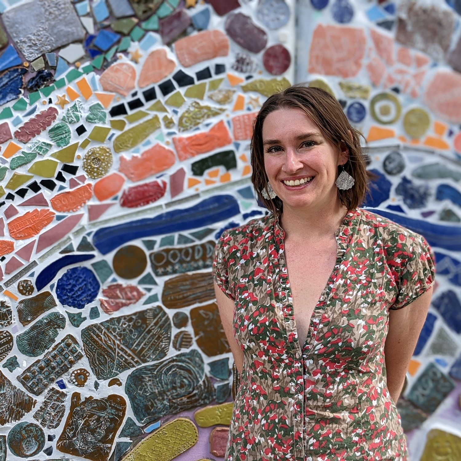 Alexandra Leonard in front of her mosaic