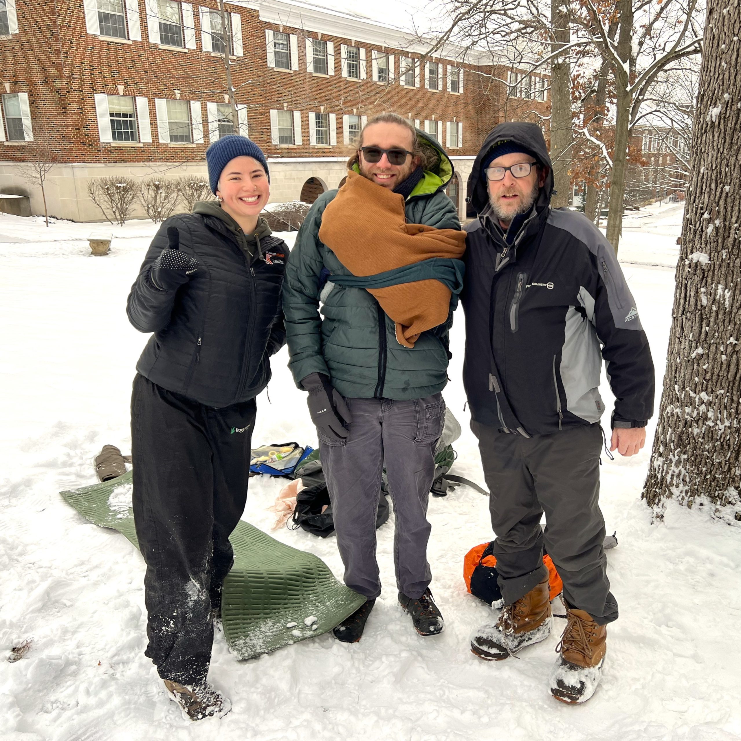 Three people participate in outdoor skills training workshops
