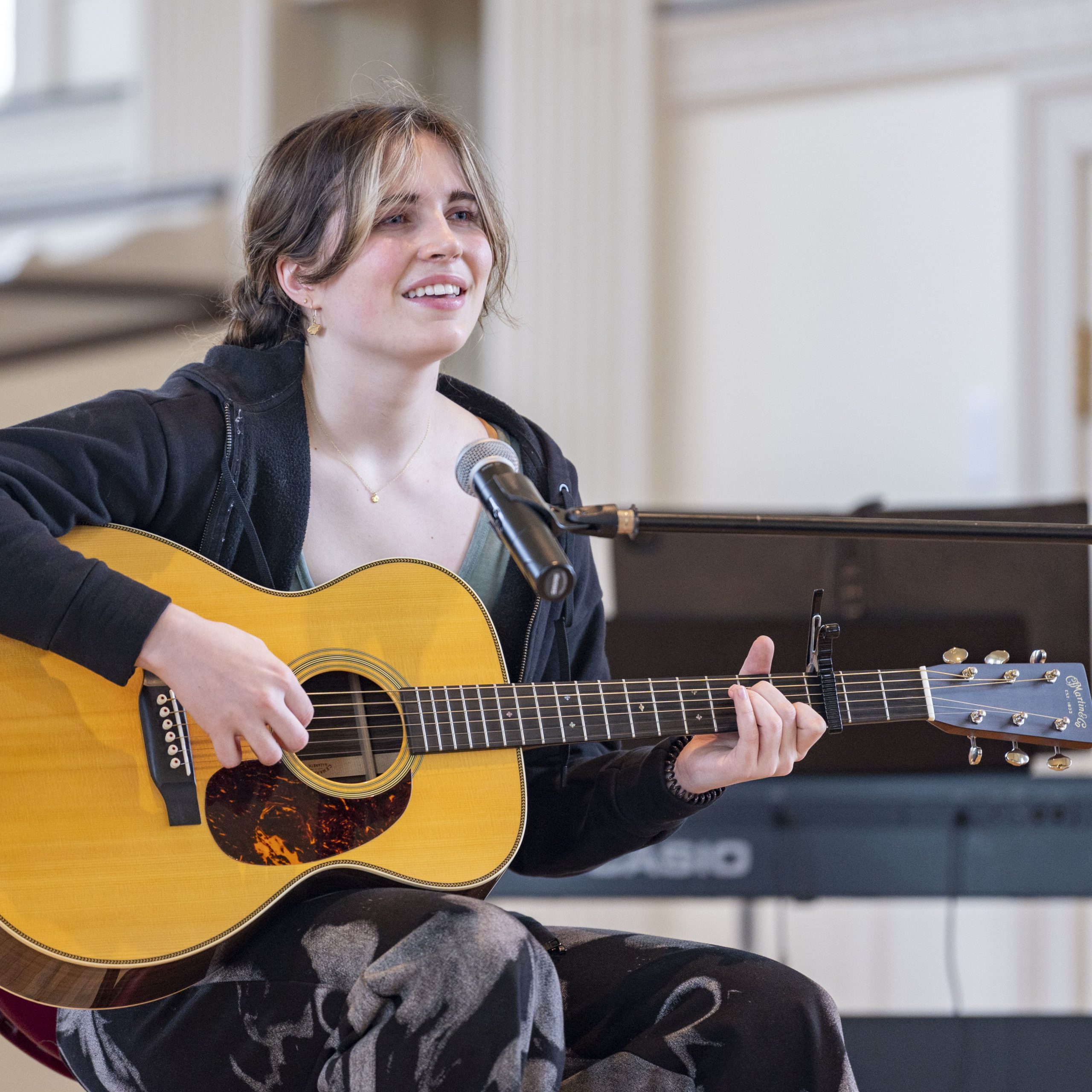 Student sings and plays guitar