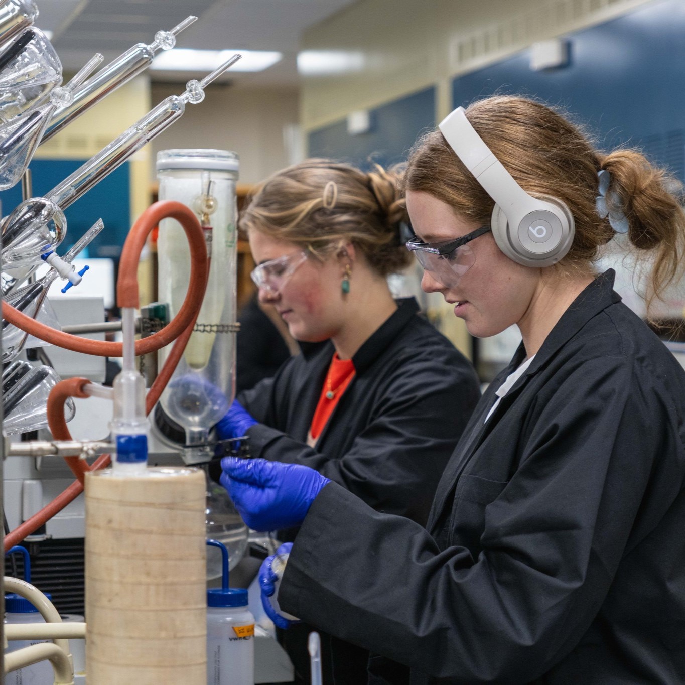 Two female students working in a chemistry lab