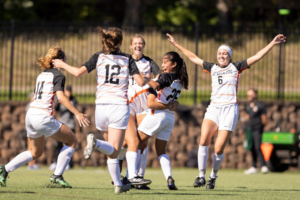 Women athletes celebrating a win