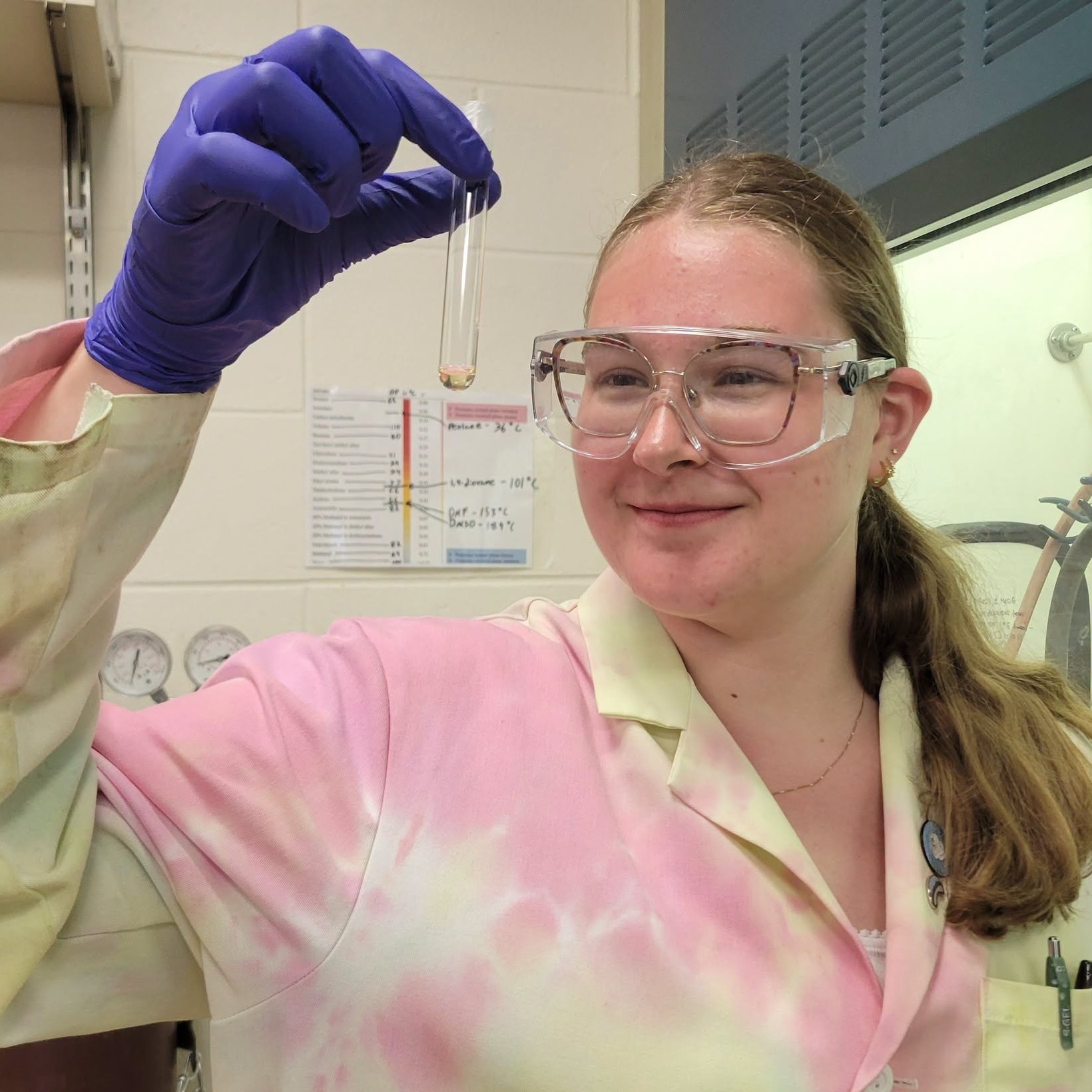 Student examines a test tube in theh chemistry lab