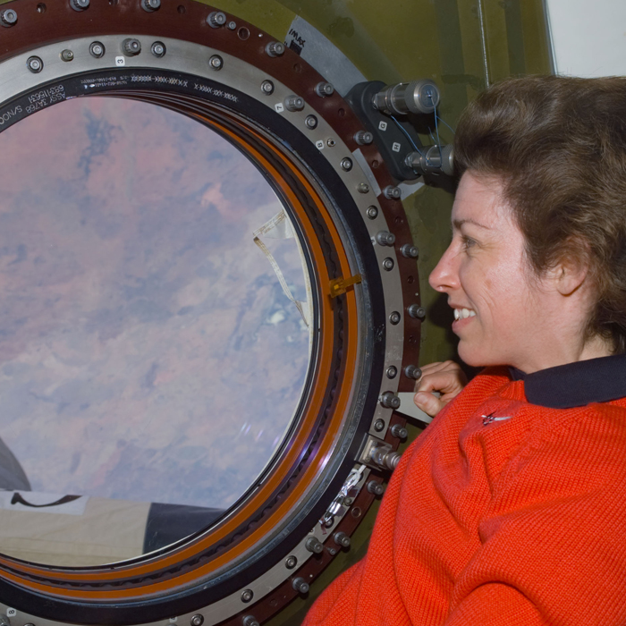 Ellen Ochoa looks out the International Space Station