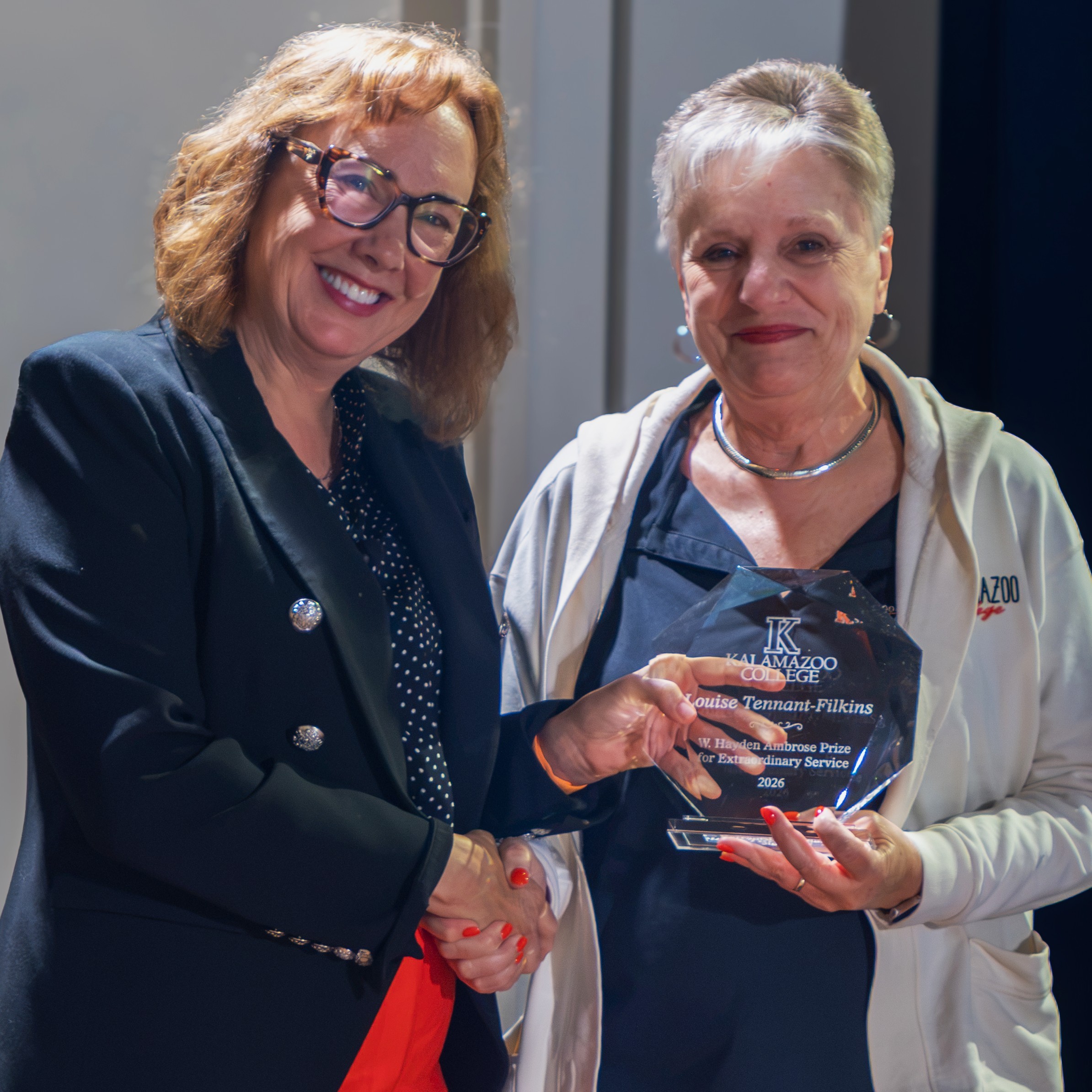 Ambrose Prize recipient Louise Tennant-Filkins with Kalamazoo College President Karlyn Crowley